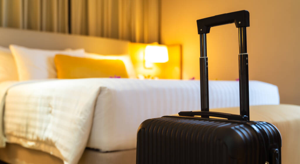 A suitcase in a hotel room